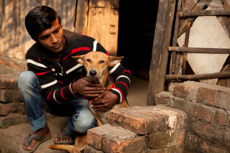 Mohammed Shoagh pictured with his dog Bullet who has just been vaccinated against rabies. 