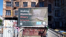 A billboard set up outside of GetYourGuide's head office calling to demand the company stops promoting and selling cruel tourist activities involving animals.