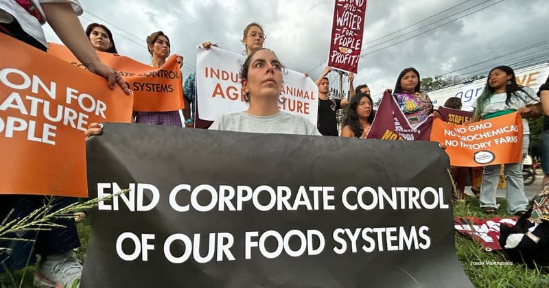 Activists confront Big Agriculture at COP30 AgriZone. Image Credit: Jason Valenzuela